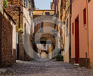 The picturesque medieval street of Ferrara, Italy photo