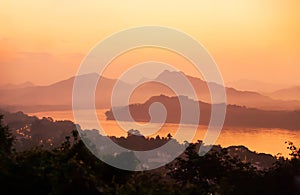 Picturesque Mekong River and Luang Prabang town at dusk