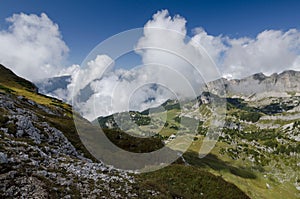 View to Rofan Alps with clouds above Achen lake, The Brandenberg Alps, Austria, Europe photo