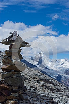 Picturesque mountain landscape in the Andes of Peru with a stone cairn in the foreground