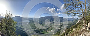 Picturesque mountain landscape of a panorama of Trento, Italy, lake, huge valley, sunny weather, clouds