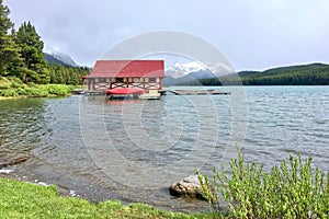 The picturesque mountain Maligne Lake in the Jasper National Park. Boat house on the lake.