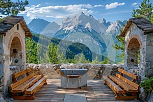 Picturesque Mountain Viewpoint with Wooden Benches and Stone Structures Overlooking Alpine Peaks