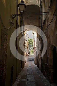 Picturesque narrow alley in Albenga, italy photo