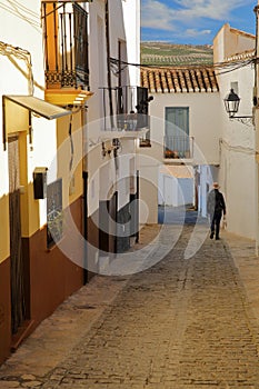 A picturesque narrow cobbled alley in Alhama de Granada photo