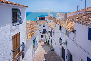 Picturesque narrow street in white village of Altea, Alicante, Spain