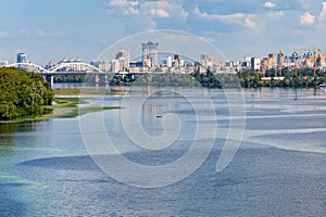 Picturesque natural landscape of the Dnipro river embankment. The city\'s residential area under construction i