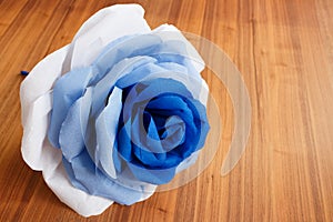 Picturesque paper rose. Origami. Giant multicolored flower.