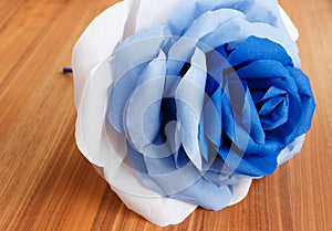 Picturesque paper rose. Origami. Giant multicolored flower.