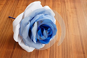 Picturesque paper rose. Origami. Giant multicolored flower.