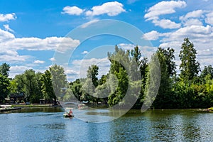 Picturesque pond with pleasure boats