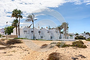 Picturesque residential buildings at the beach in Corralejo