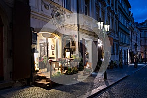 Picturesque Restaurant Illuminated By Streetlamp Lanterns In The Streets Of Prague In The Czech Republic