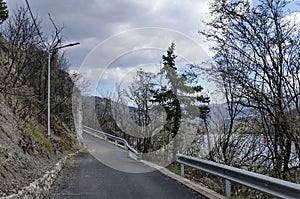 Picturesque road at Lozen mountain in springtime cloudy day