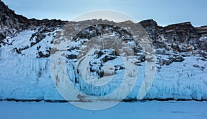 A picturesque rock, devoid of vegetation, against the blue sky.