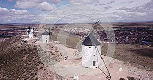 Picturesque rural landscape of Consuegra with famous windmills in sunny day, Spain