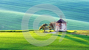 Picturesque rural landscape with old windmill