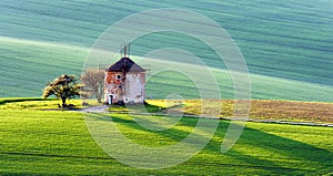 Picturesque rural landscape with old windmill