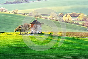 Picturesque rural landscape with old windmill