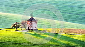 Picturesque rural landscape with old windmill