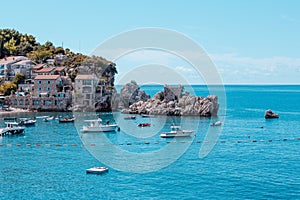 A picturesque sea bay among the mountains and rocks on the Adriatic sea coast. Mediterranean seascape with houses tiled