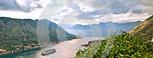 Picturesque sea view of Boka Kotorska, Montenegro, Kotor old town. Shoot from air, from mountain fortification, wide angle, sunset