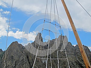 Picturesque silhouettes of the rocks of the extinct volcano Karadag from the side of a sailing ship against the background of a