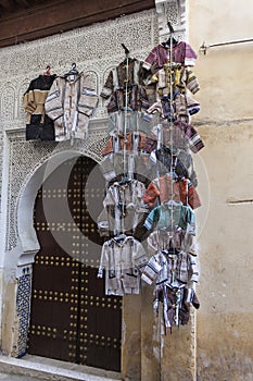 Picturesque small street in souk of Fez medina (old town) with m