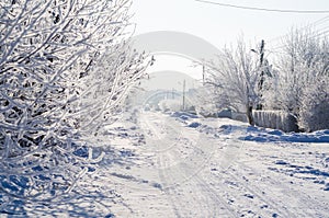 Picturesque snow-covered road in the countryside in winter