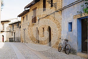 Picturesque spanish old town street with an old bicycle