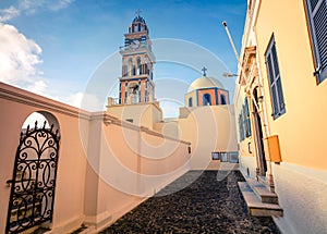 Picturesque spring scene of the Catholic Cathedral Church of Saint John The Baptistm in Fira village, Greece