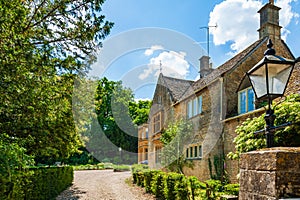 Picturesque stone cottage house on sunny day