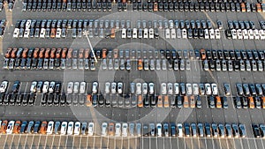 Picturesque storage parking with coloured car rows aerial