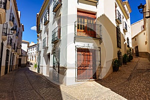 Picturesque streets with whitewashed houses and barred windows in the Andalusian village of Velez Rubio. photo