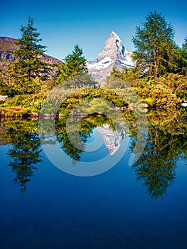 Picturesque summer morning on the Grindjisee lake. Great view of  Matterhorn Monte Cervino, Mont Cervin peak, Swiss Alps,