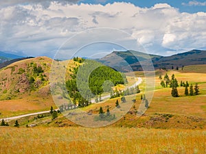 Picturesque summer mountain landscape with road through the pass. Turn on the asphalt mountain highway. Chuysky tract and a view