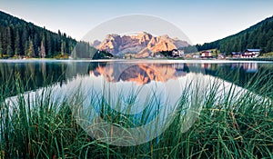 Picturesque summer sunrise on Misurina lake. Wonderful morning scene of National Park Tre Cime di Lavaredo, Location Auronzo,