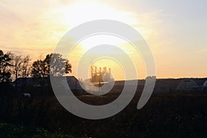 A picturesque sunset over a farm in the countryside