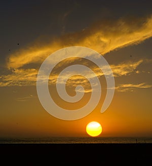 Picturesque sunset over sea and beach