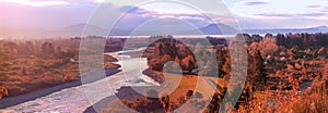 Picturesque sunset over Tongariro river and lake Taupo