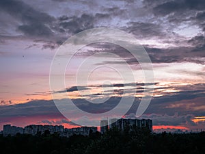 Picturesque sunset sky over buildings on the horizon in Kyiv city