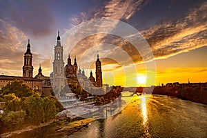 Picturesque sunset on a summer day in the city of Zaragoza in Spain overlooking the river and the cathedral