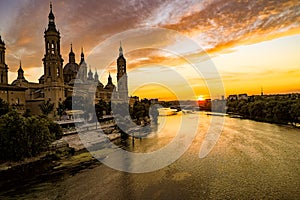 Picturesque sunset on a summer day in the city of Zaragoza in Spain overlooking the river and the cathedral