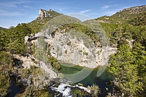 Picturesque Tajo river landscape in autumn. Poveda waterfall. Guadalajara, Spain