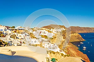 Picturesque traditional villas and scenery of Oia town Santorini Greece