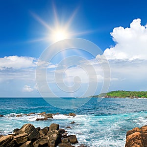 Picturesque tropical beach with coastal rocks