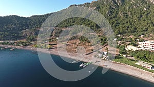 Picturesque Turkish Bay Kumlubuk. Footage from the drone. View of the Bay with piers and beach