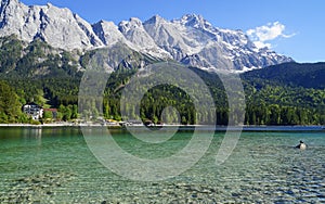 picturesque turquois alpine lake Eibsee by foot of mountain Zugspitze in Bavaria (Garmisch-Partenkirchen, Germany)