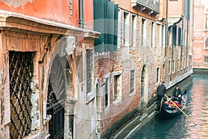 Picturesque view of ancient buildings, bridge and channel with gondolas in Venice, Italy. Beautiful romantic italian city.