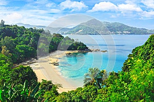 Picturesque view of Andaman sea in Phuket island, Thailand. View through the jungle on the beautiful bay and mountains.